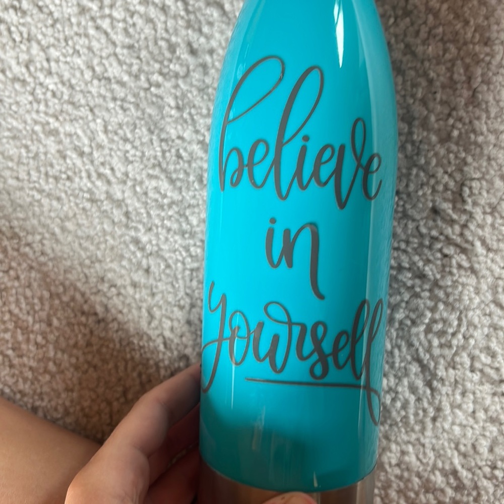 Blue 22oz with grey lettering believe in yourself. Hand wash only